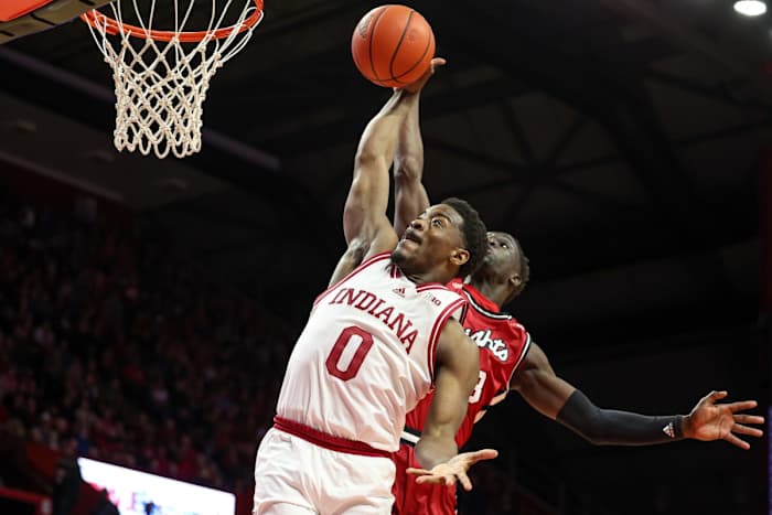 Indiana Hoosiers guard Xavier Johnson (0) drives to the basket as Rutgers Scarlet Knights forward Mawot Mag (3) defends during the first half at Jersey Mike's Arena.